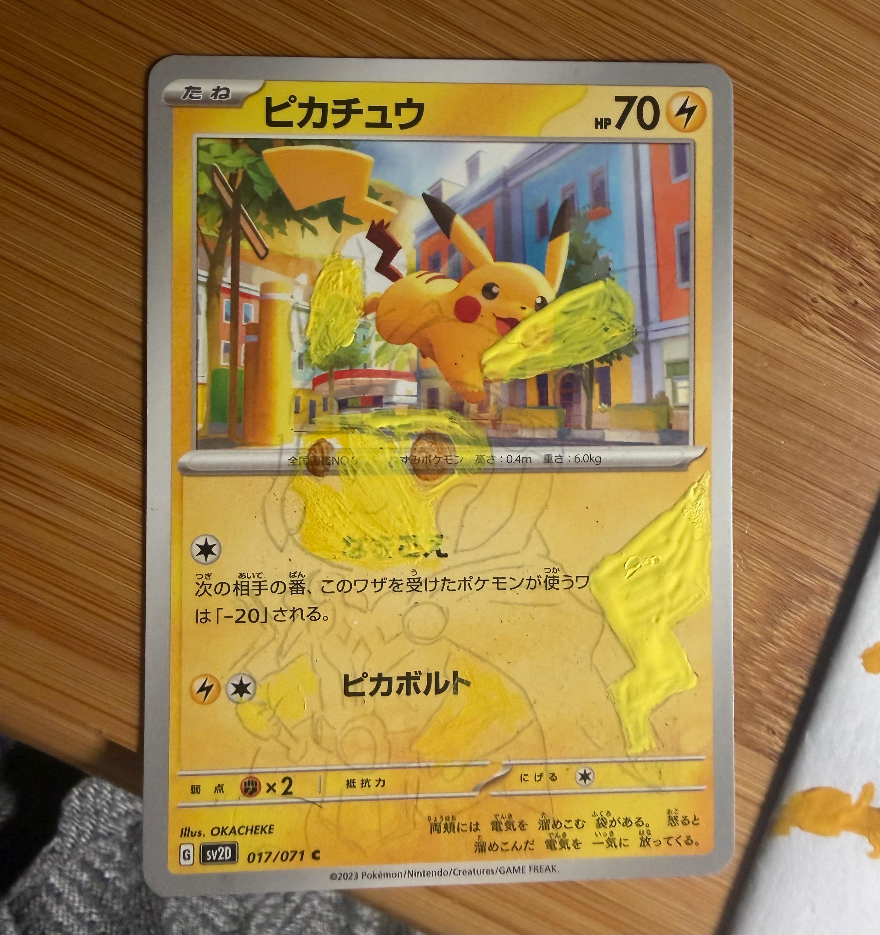Stage one: the first yellow paint and pencil outlines extend from the Pikachu card.